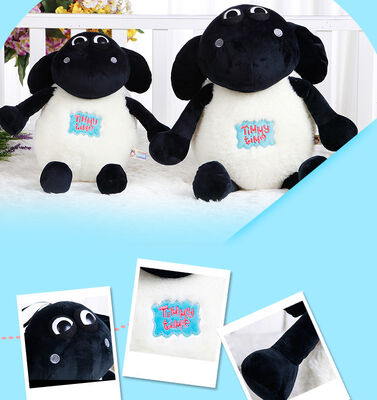 La peluche molle animale de moutons de Shaun de bande dessinée joue le blanc noir bourré chaud