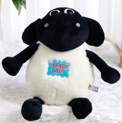La peluche molle animale de moutons de Shaun de bande dessinée joue le blanc noir bourré chaud