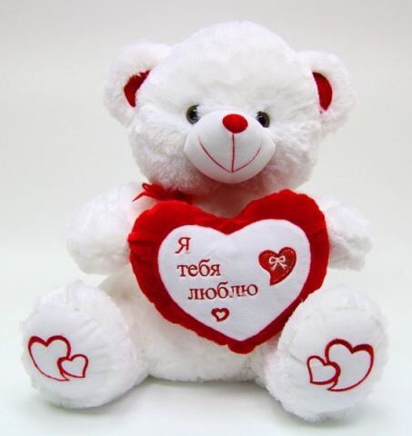 Le beau jour de valentines bourré joue le petit ours de nounours blanc de peluche pour la prime